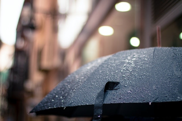 An open umbrella in the rain.